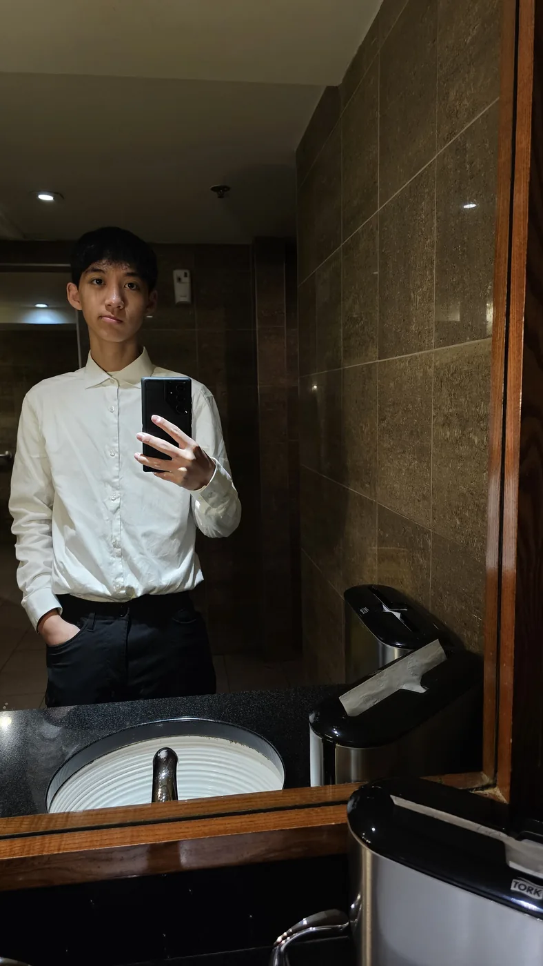 Aaron in a white dress shirt